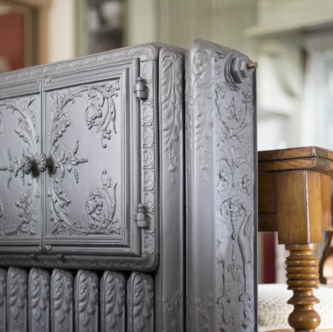 Lifestyle photo of vintage radiator in a home setting.