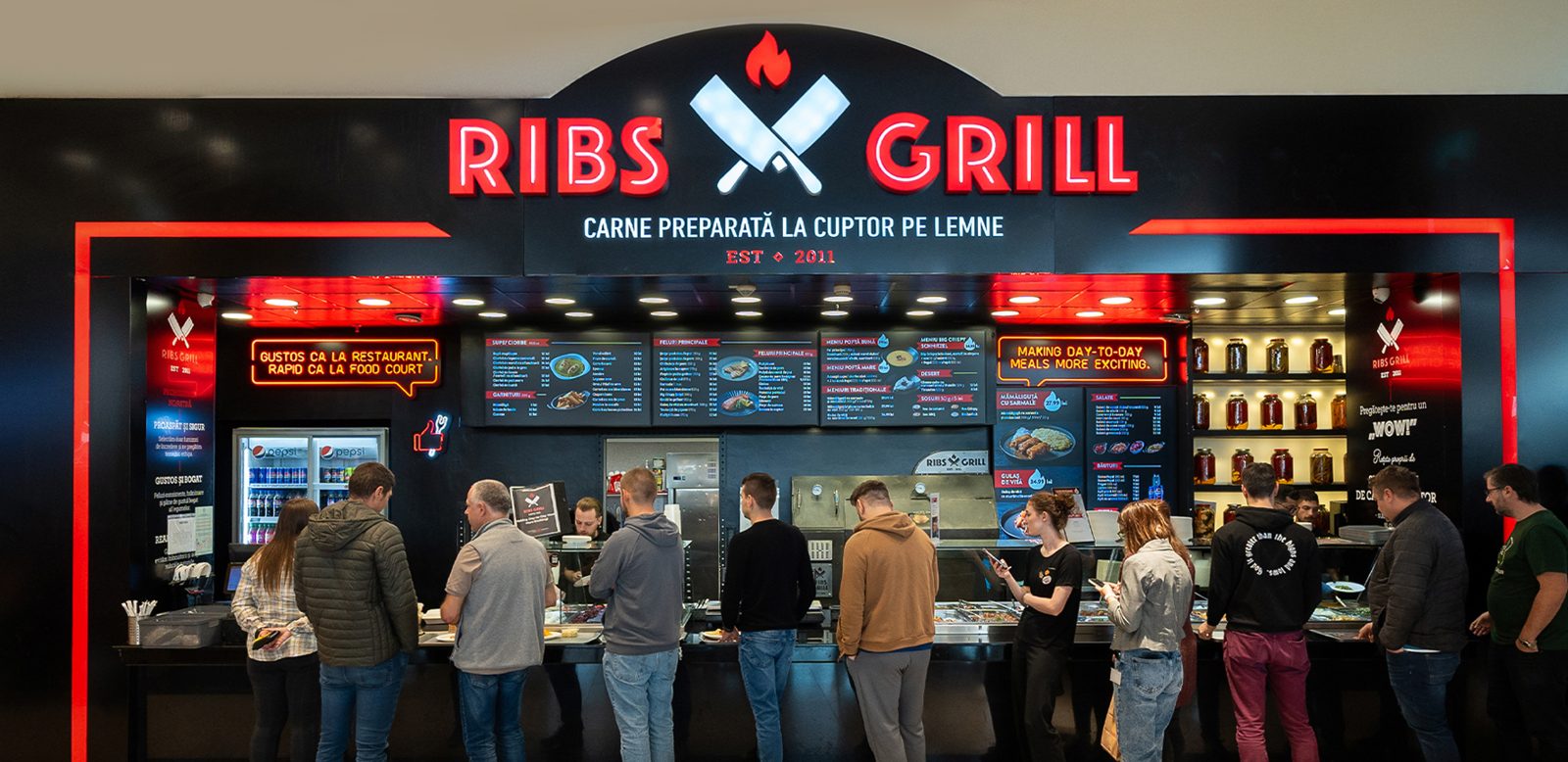 Outdoor signage design for Ribs Grill restaurants.