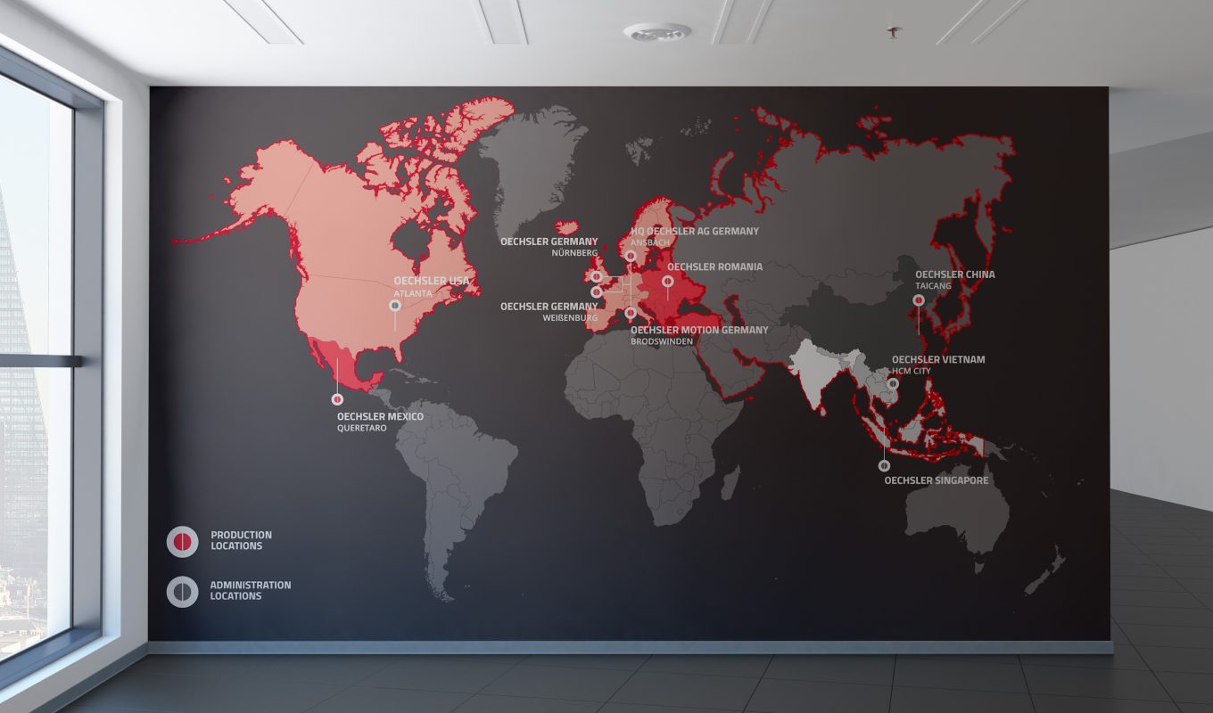 Corporate signage with Oechsler branding.